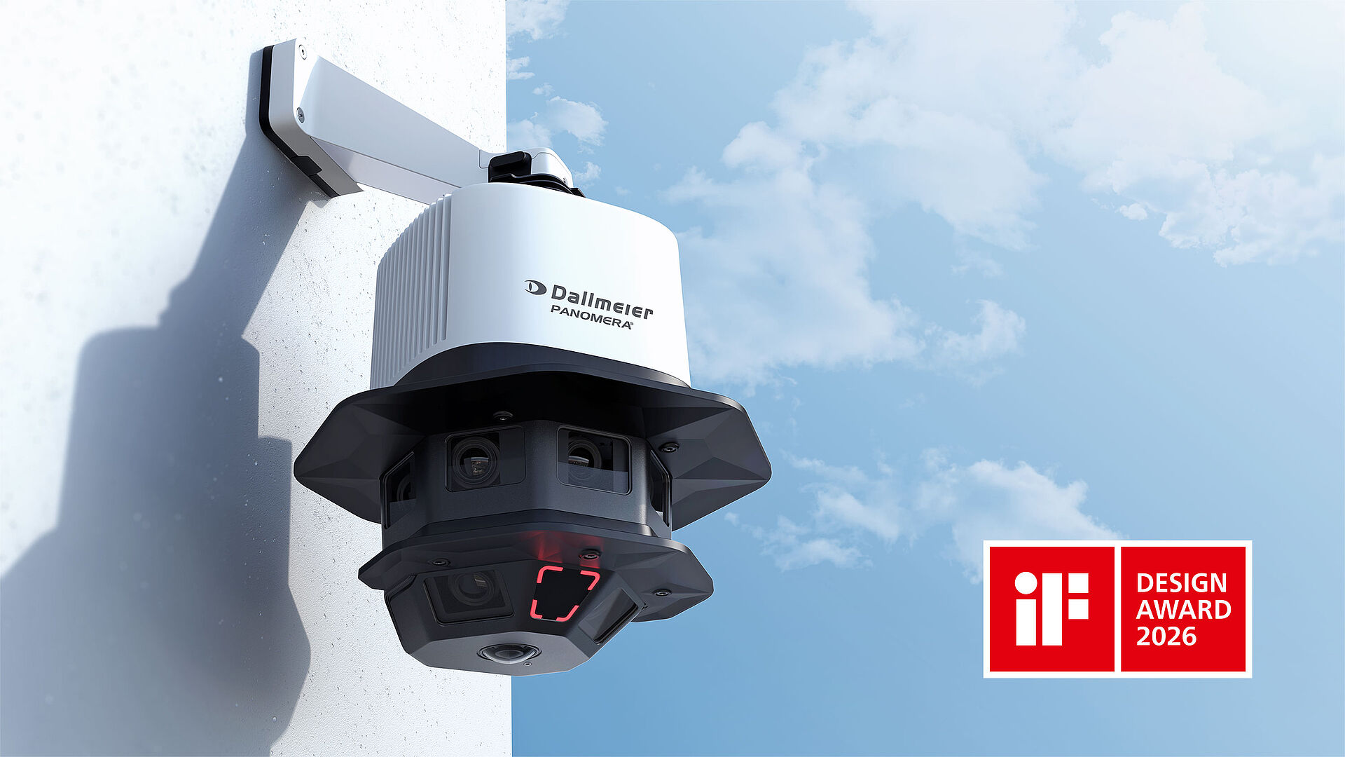 A mounted surveillance camera with multiple lenses is attached to a wall, accompanied by a badge indicating the 2026 iF Design Award. The background features a clear blue sky.