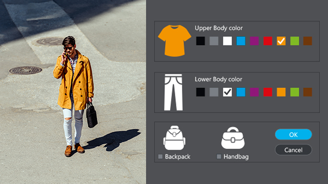 Man wearing an orange coat and white pants gets recognized with Attribute Finder.