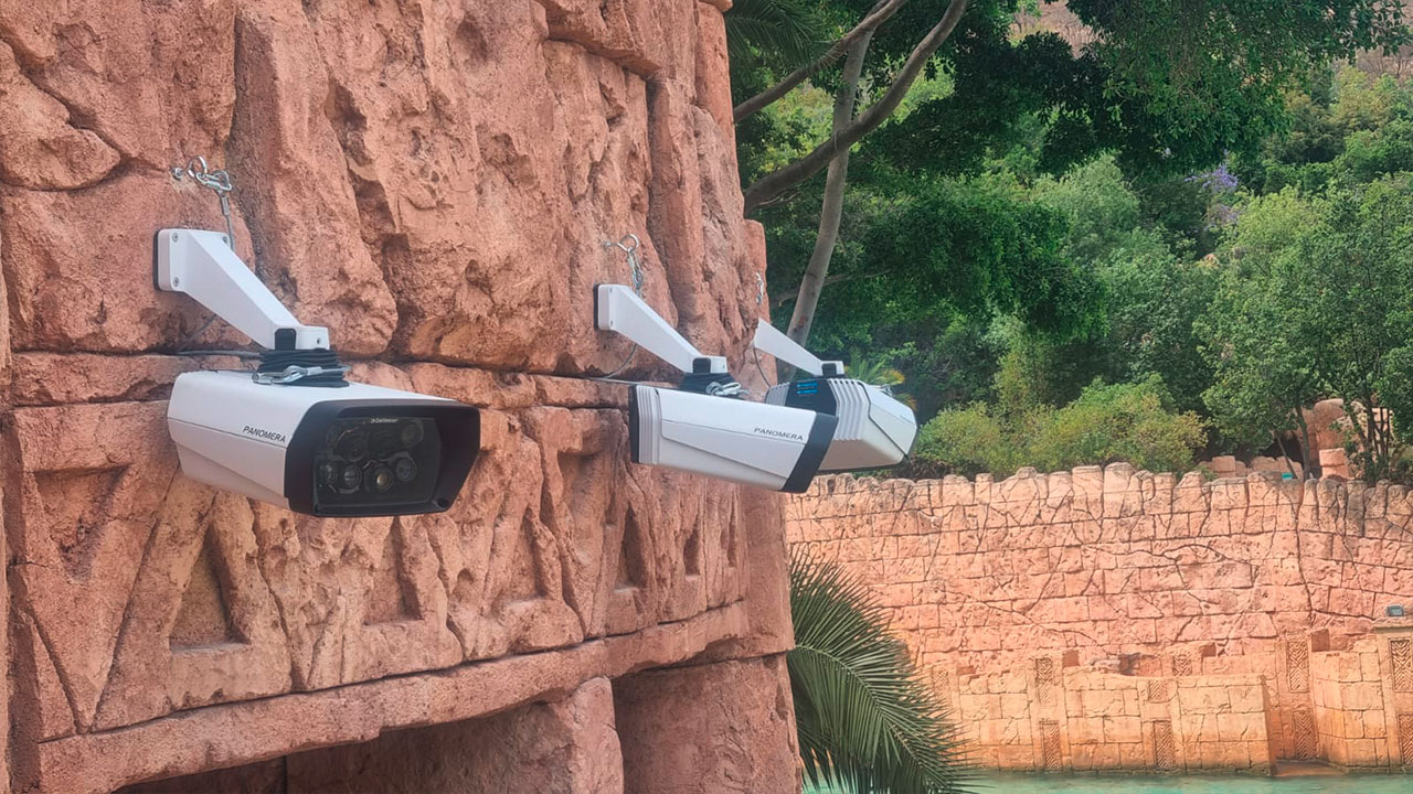 Three Panomera® surveillance cameras mounted on a stone wall.