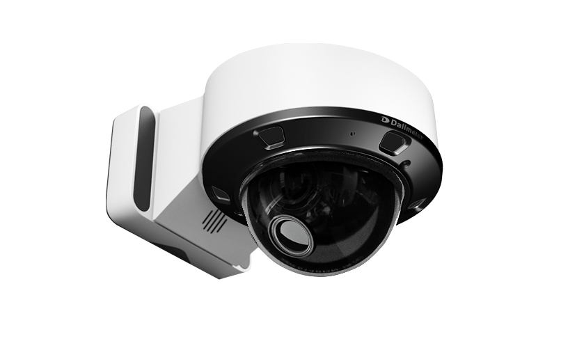 A white dome security camera mounted on a wall, featuring a round lens and black detailing around the lens area.