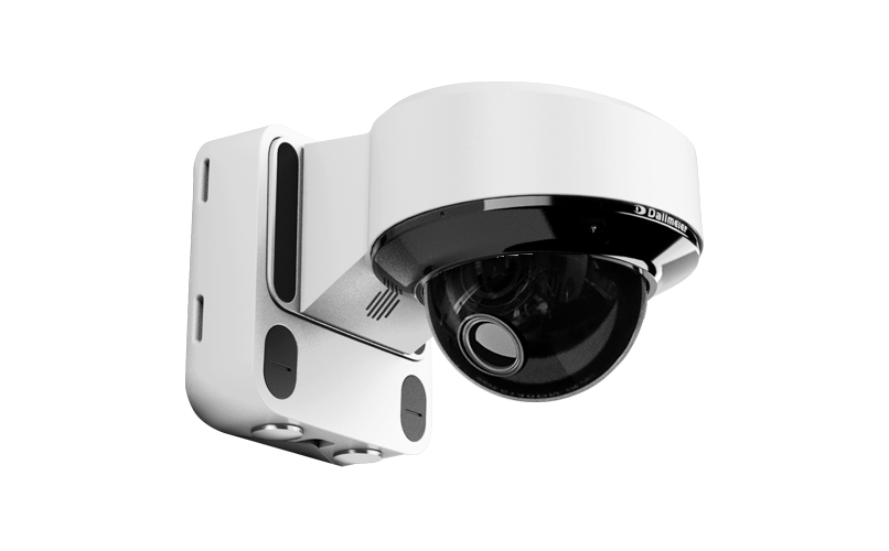 A mounted security camera with a round lens and a white casing, designed for surveillance purposes.